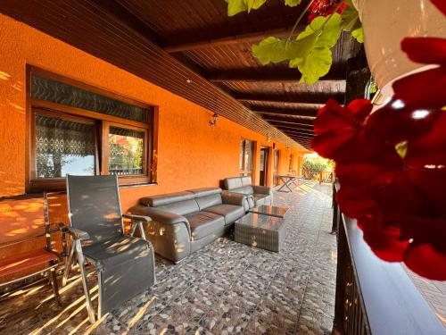 a living room with couches and chairs in a building at Casa Maria in Streiu