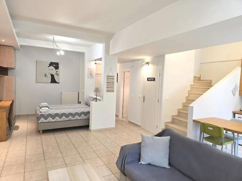 A bed or beds in a room at Xtina Studio