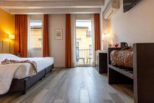 Postel nebo postele na pokoji v ubytování Relais Santa Corona