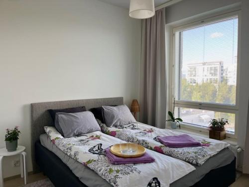 Ένα ή περισσότερα κρεβάτια σε δωμάτιο στο Easy&comfortable living in the middle of services
