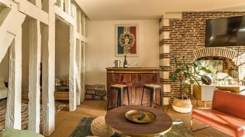 Μια τηλεόραση ή/και κέντρο ψυχαγωγίας στο Chambre Privée Chez l'Habitant Confort Charme Hypercentre