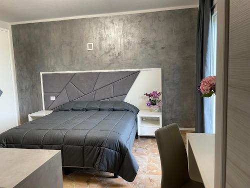 Ένα ή περισσότερα κρεβάτια σε δωμάτιο στο B & B Verde Natura