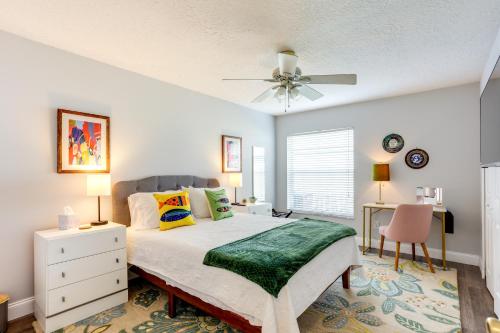 a bedroom with a bed and a ceiling fan at Inviting Jensen Beach Home with Screened-In Patio! in Jensen Beach