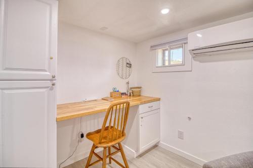 a kitchen with a wooden counter and a wooden chair at Great Find! Downtown Oasis with Office Setup in Twin Falls