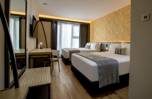 Кровать или кровати в номере Hotel Catedral