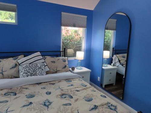 Postel nebo postele na pokoji v ubytování Hill Street Cottage