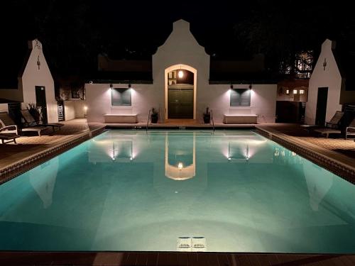 a swimming pool in front of a house at night at Inlet Beach - 70 Pinecrest in Panama City Beach