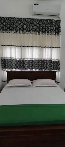 Postel nebo postele na pokoji v ubytování Hotel Lakeside