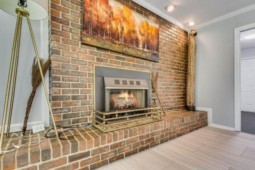 a brick wall with a fireplace in a room at The Secluded 7-Acre Elegant Escape in Conyers