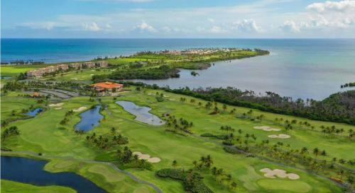 an aerial view of a golf course next to the ocean at Beach & Golf Course Views in Rio Grande