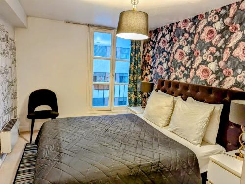 En eller flere senge i et værelse på Opera Louvre HolidayApartment