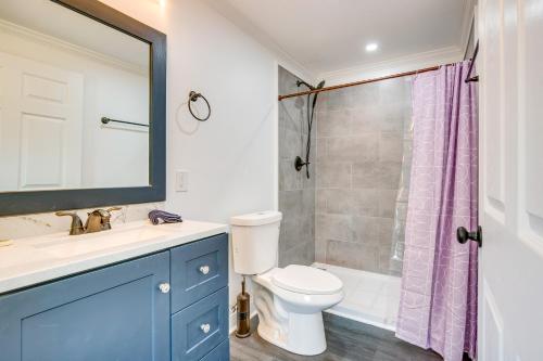 a bathroom with a toilet and a sink and a shower at Walk to Winery Holt Home 8 Mi to State Park! in Kearney