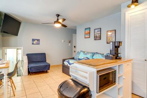 a living room with a bed and a desk in a room at Less Than 1 Mi to Boardwalk and Beach Access Ocean City Apt! in Ocean City