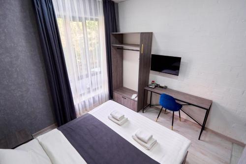 Televisyen dan/atau pusat hiburan di Minguzar Hotel