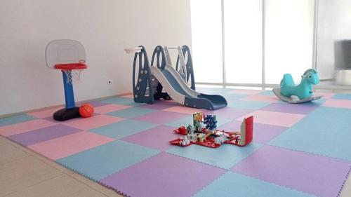 a room with a gym with toys on the floor at Moscato Hotel in Lembang