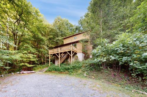 a house in the middle of a forest at Boulder Ridge Hideaway in Boone