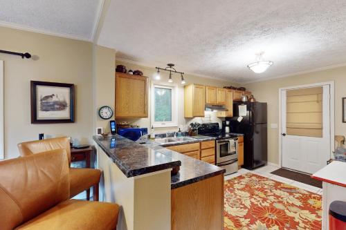 a kitchen with a sink and a counter top at Boulder Ridge Hideaway in Boone