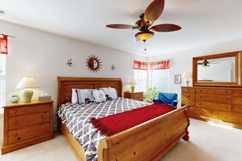 a bedroom with a bed and a ceiling fan at Wedgefield --- 23 Wedgefield in Ocean View