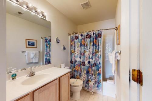 a bathroom with a sink and a shower curtain at Wedgefield --- 23 Wedgefield in Ocean View