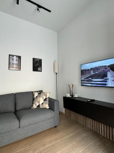TV a/nebo společenská místnost v ubytování 48 Cadorna - Sostify