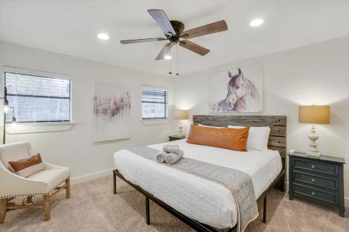 a bedroom with a bed and a ceiling fan at Your Rustic Retreat w Backyard Oasis Pool Patio in Keller