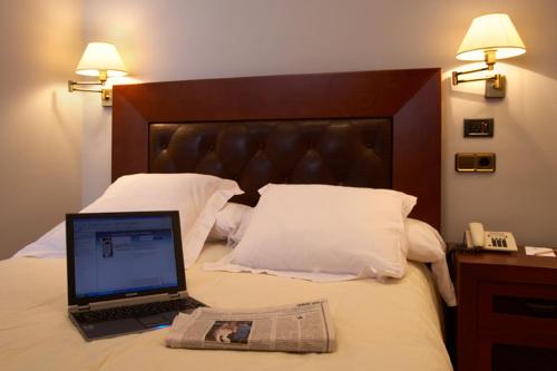 Postel nebo postele na pokoji v ubytování Hotel Juanito