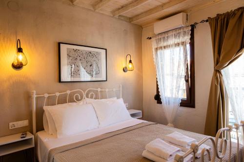 Postel nebo postele na pokoji v ubytování Leontis