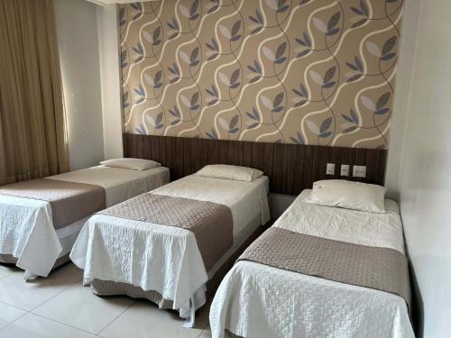 Ένα ή περισσότερα κρεβάτια σε δωμάτιο στο Premier Pallace Hotel