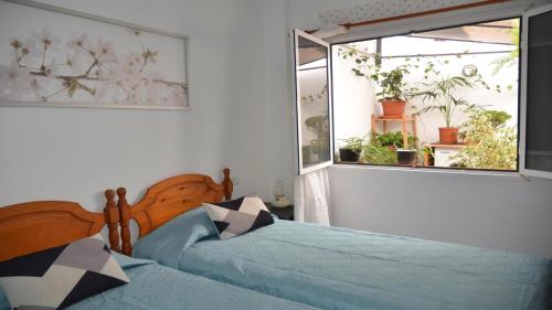 Ένα ή περισσότερα κρεβάτια σε δωμάτιο στο Apt. ManRey 1A - Aguamarina