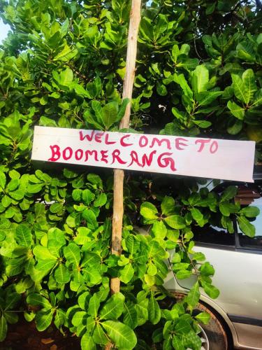 a sign that reads welcome to boomedong at Boomerang community in Auroville