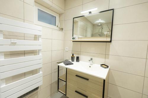 Ένα μπάνιο στο Appartement cosy et lumineux à Kaysersberg