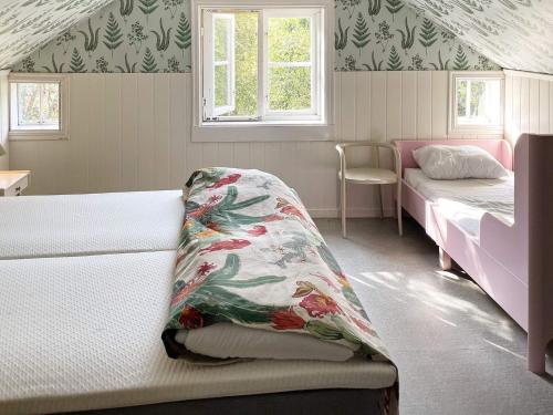 a bedroom with two beds and a window at 6 person holiday home in TINGSRYD-By Traum in Tingsryd