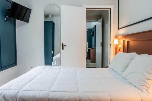 Ένα ή περισσότερα κρεβάτια σε δωμάτιο στο Hotel Serra Canela
