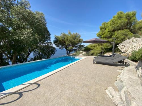 Πισίνα στο ή κοντά στο Holiday home Kuzma with private pool and sea view