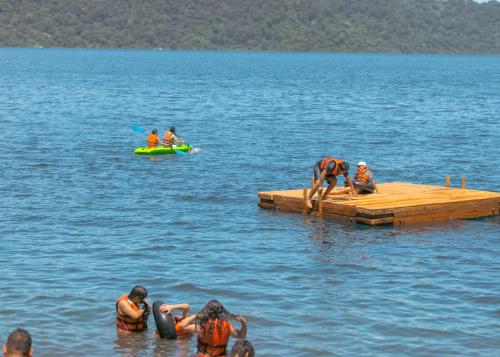 a group of people on a dock in the water at Coco Bay in La Laguna