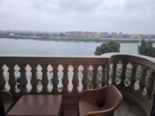 a balcony with a view of a river at Luxury 2BH with full Cairo Nile view in Cairo