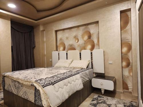 a bedroom with a large bed in a room at Luxury 2BH with full Cairo Nile view in Cairo