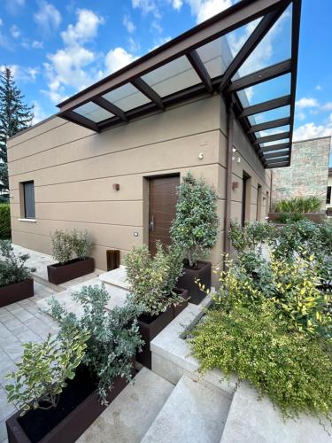 a house with plants in front of it at Paradise House in Luco dei Marsi
