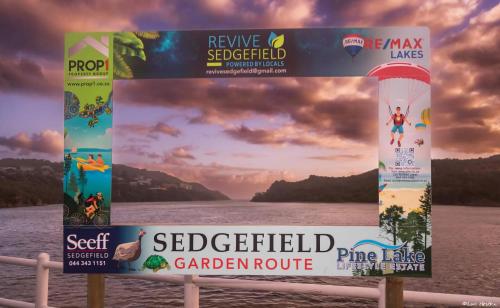 a sign on the side of a body of water at Ria's Rest Self Catering Flatlet in Sedgefield