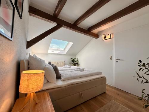 a bedroom with a bed in a room with a window at YourFavoriteBed Designerapartments Zwickau Zentrum in Zwickau