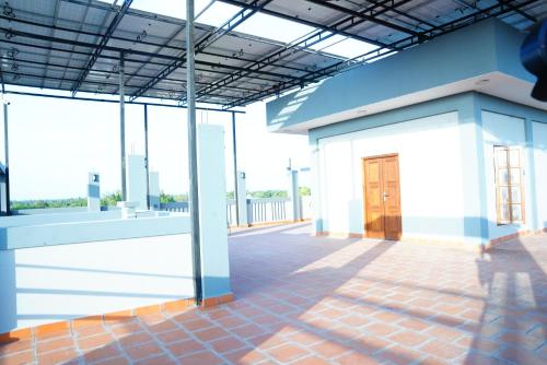a rendering of a building with a porch at Vaishana Residency in Jaffna