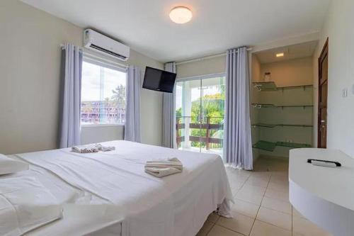 Ένα ή περισσότερα κρεβάτια σε δωμάτιο στο Casa espaçosa no Prive Baia do Cupe