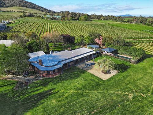 an overhead view of a large house in a field at Yarra Yering Homestead in Gruyere