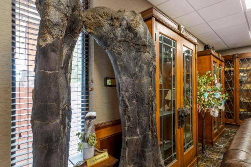 a large statue of a tree in a lobby at Best Western Denver Southwest in Lakewood