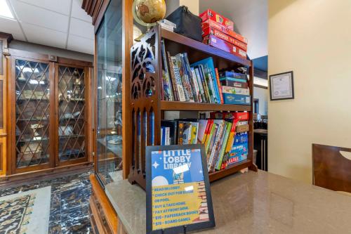 a book shelf filled with books in a store at Best Western Denver Southwest in Lakewood