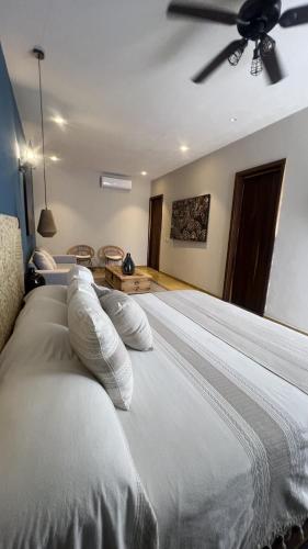 Postel nebo postele na pokoji v ubytování Hotel Boutique Gloriagave