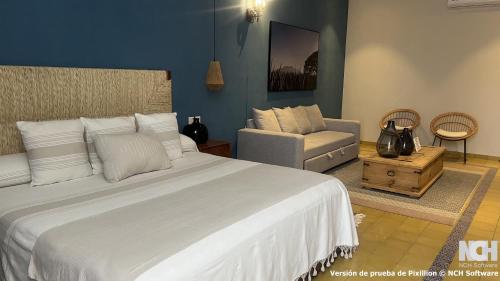Postel nebo postele na pokoji v ubytování Hotel Boutique Gloriagave