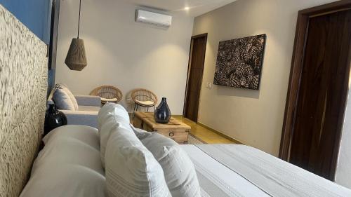 Postel nebo postele na pokoji v ubytování Hotel Boutique Gloriagave