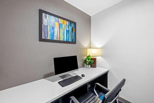 a office with a desk with a computer and chairs at Best Western Palace Inn & Suites in Big Spring