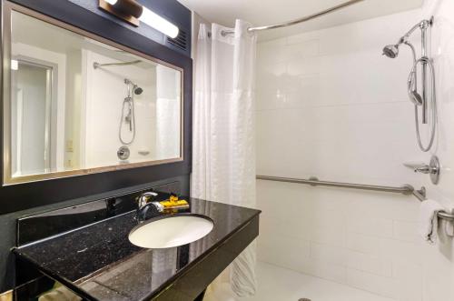 a bathroom with a sink and a shower at Best Western Plus Beckley Inn in Beckley